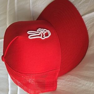 Red snapback trucker / baseball hat with peace sign unisex. NWOT